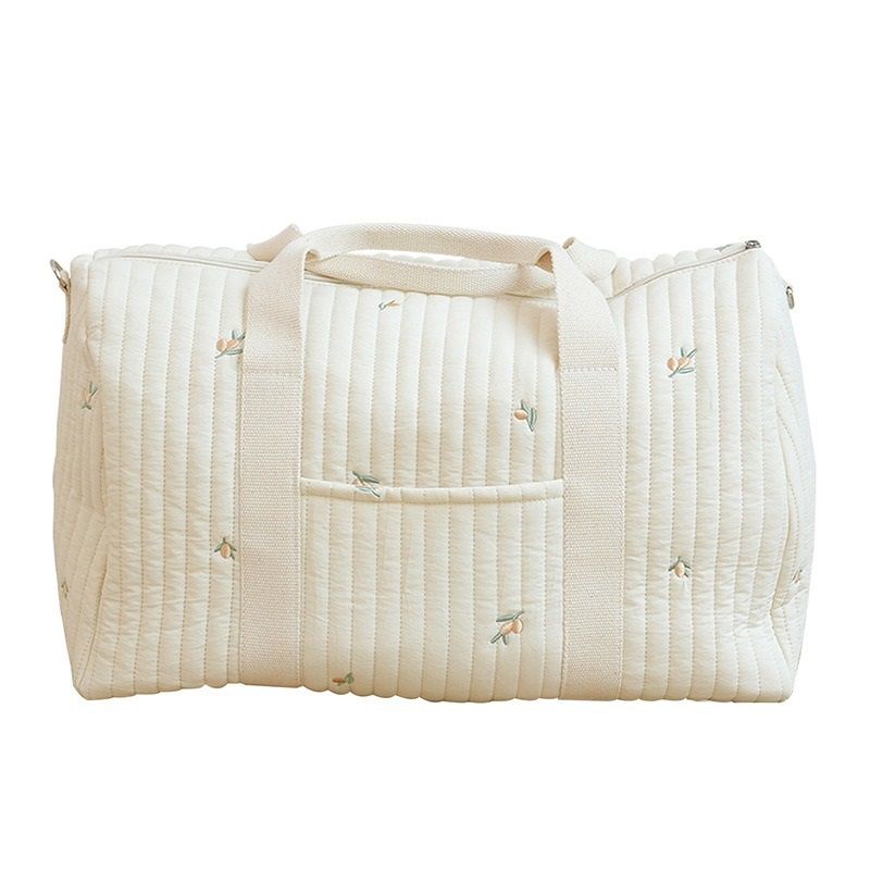 Wickeltasche aus bestickter und gesteppter Baumwolle