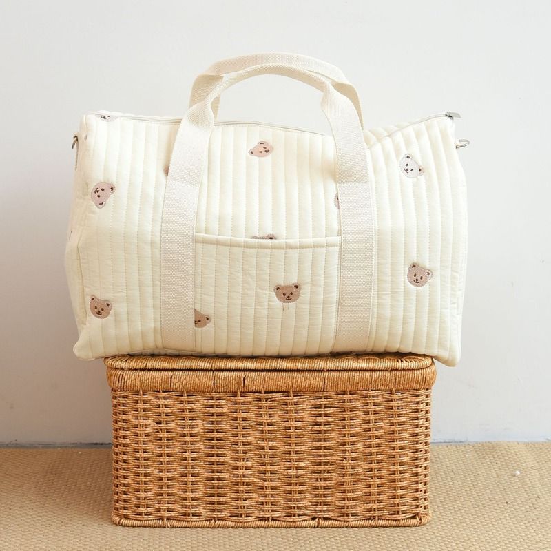 Wickeltasche aus bestickter und gesteppter Baumwolle 