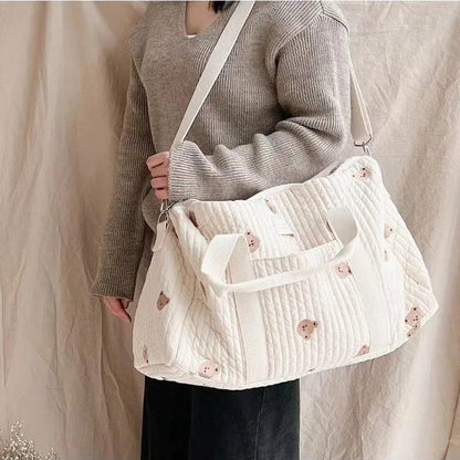 Wickeltasche aus bestickter und gesteppter Baumwolle 