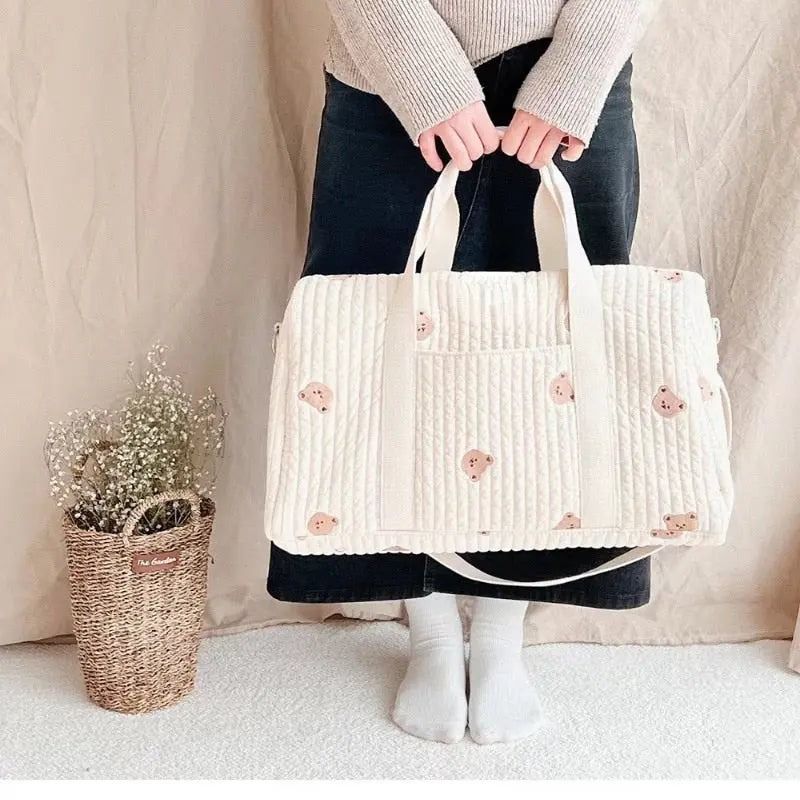 Wickeltasche aus bestickter und gesteppter Baumwolle 