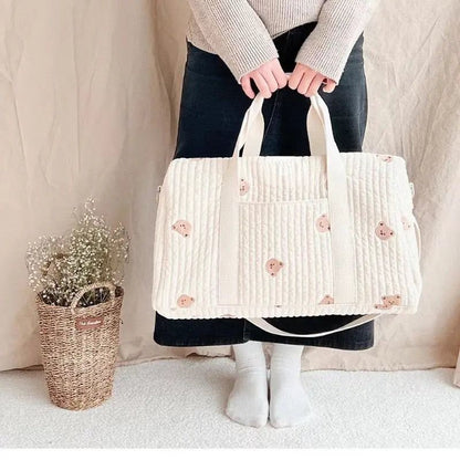 Wickeltasche aus bestickter und gesteppter Baumwolle 