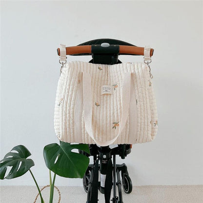 Wickeltasche aus bestickter und gesteppter Baumwolle 