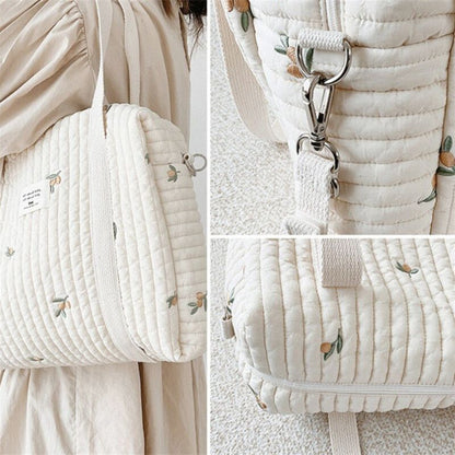 Wickeltasche aus bestickter und gesteppter Baumwolle 