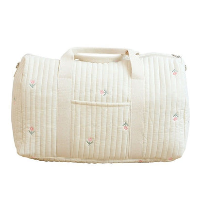 Wickeltasche aus bestickter und gesteppter Baumwolle 