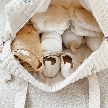 Wickeltasche aus bestickter und gesteppter Baumwolle 